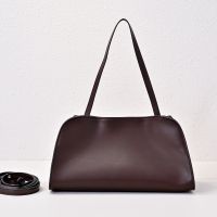 The Row Peggy Clutch Bag in Polished Saddle Leather Chestnut